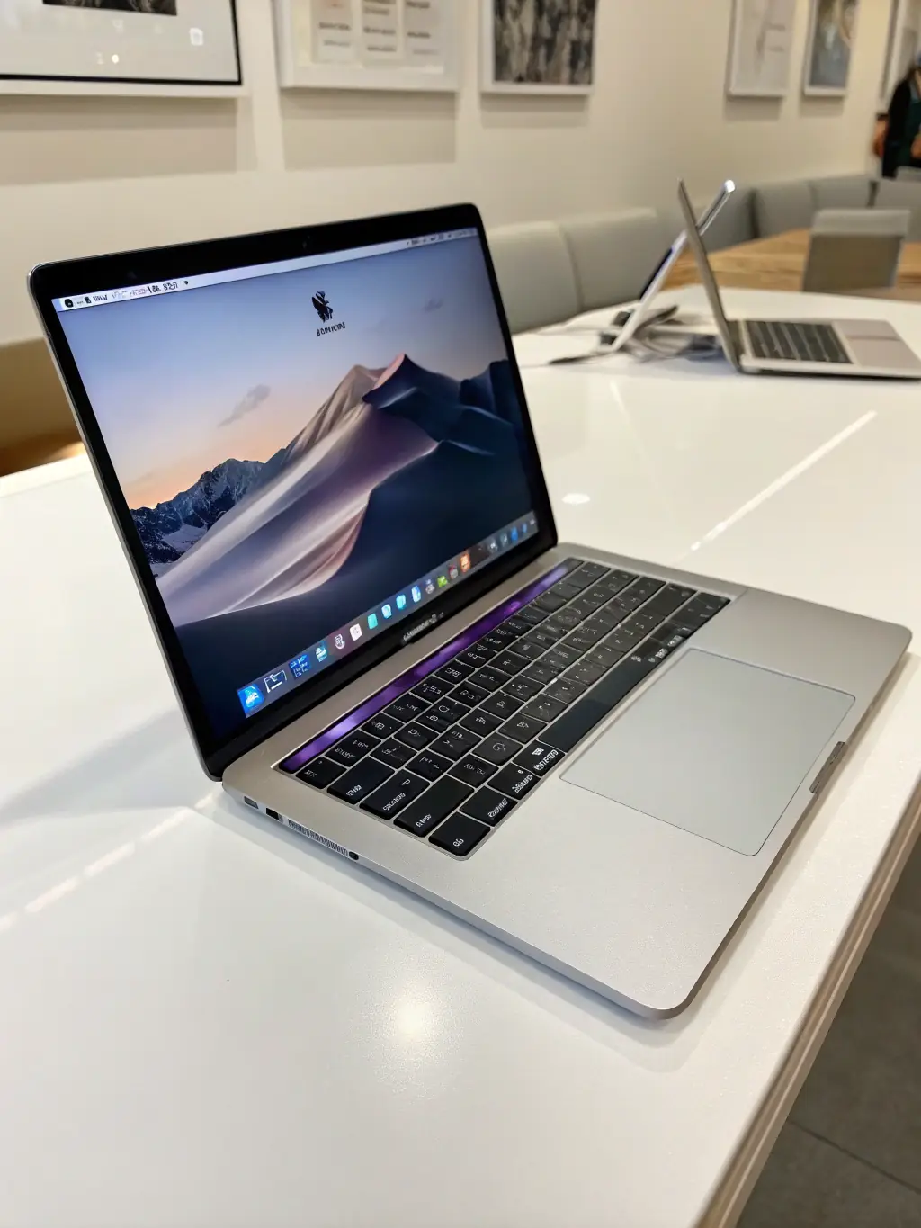 A high-resolution photo of a used MacBook Pro in excellent condition, displayed on a clean white surface, highlighting its sleek design and functionality.